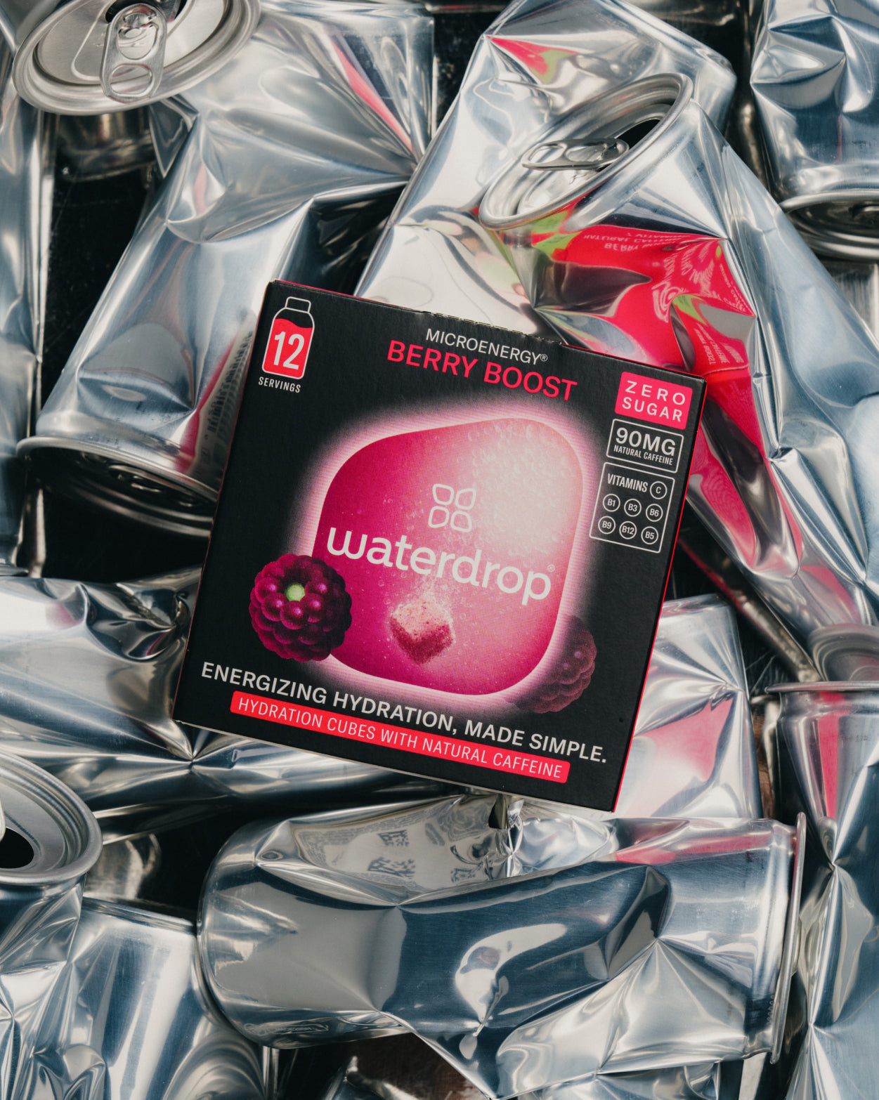 Main Character Energy Set atop crushed cans, featuring 12 hydration cubes.